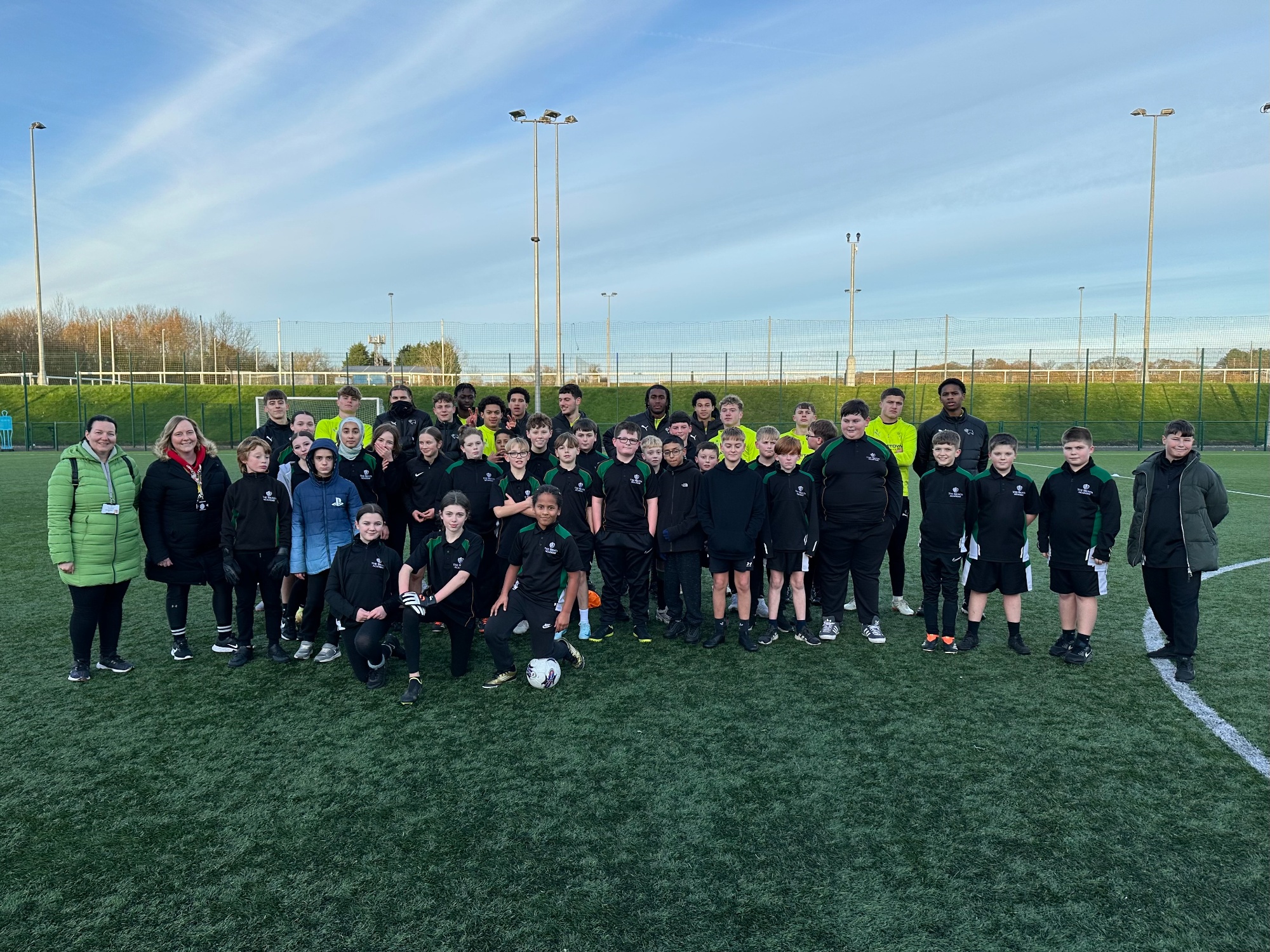 Group photo of student at Derby training ground